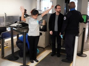 Transportation Security Administration agents check passengers at a security checkpoint at LaGuardia Airport in  New York City, on Jan. 31, 2019.