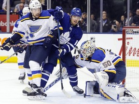 Maple Leafs left wing Andreas Johnsson battles for position in front of the Blues net during NHL action in Toronto on Oct. 7, 2019.