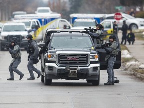 York Regional Police tactical officers at an armed standoff on Elmwood Ave., near Major Mackenzie Dr. and Bayview Ave. in Richmond Hill, Ont., on Friday Dec. 27, 2019.