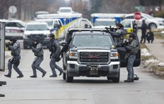 York Regional Police tactical officers at an armed standoff on Elmwood Ave., near Major Mackenzie Dr. and Bayview Ave. in Richmond Hill, Ont., on Friday Dec. 27, 2019.