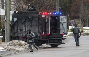 York Regional Police tactical officers at an armed standoff on Elmwood Ave., near Major Mackenzie Dr. and Bayview Ave. in Richmond Hill, Ont., on Friday, Dec. 27, 2019.