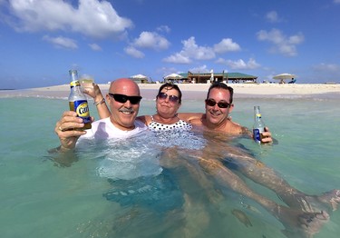 American tourists enjoy the balmy water at Sandy Island, off the coast of Anguilla