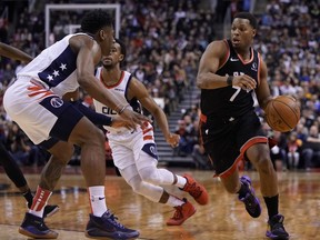 Toronto Raptors guard Kyle Lowry dribbles the ball around Washington Wizards guard Admiral Schofield during the second half at Scotiabank Arena.