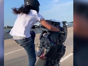 A biker nicknamed 'Baby Jesus' stands on his motorcycle while taunting cops and weaving through traffic, but later surrendered