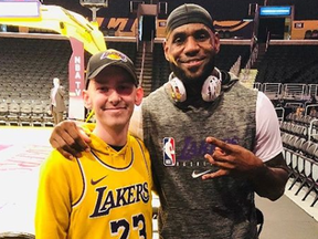 Corey Groves, left, with hero LeBron James on Christmas Day 2019 in Los Angeles.