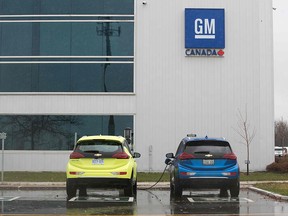 Two electric vehicles are being charged at the General Motors plant in Oshawa, Ont., on November 26, 2018. (LARS HAGBERG/AFP/Getty Images)