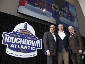 Anthony LeBlanc, Founding Partner, Schooners Sports and Entertainment, Randy Ambrosie, Commissioner, Canadian football League, and Greg Turner, Councillor-at-Large and Deputy Mayor, City of Moncton pose for a photo at a press conference in Moncton, N.B., on Friday, March 29, 2019.