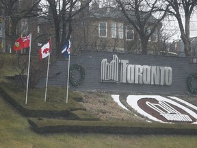 The Canadian flag upside down at the City of Toronto display sign along the Gardiner Expressway on Tuesday, December 31, 2019. Jack Boland/Toronto Sun