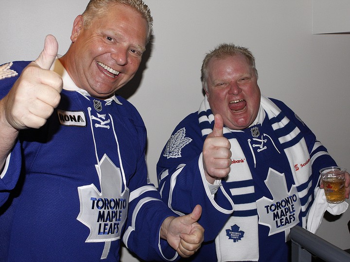  Doug and Rob Ford celebrate at a Toronto Maple Leafs game in this undated file photo.