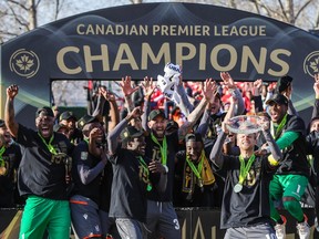 Forge FC players celebrate after defeating Cavalry FC during a Canadian Premier League soccer final match at Spruce Meadows in Calgary on Nov. 2, 2019.