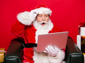 Winter noel december eve christmastime package. Aged mature Santa spectacles open mouth eyes white beard isolated red background look pc wondered astonishment face receive unbelievable email letter