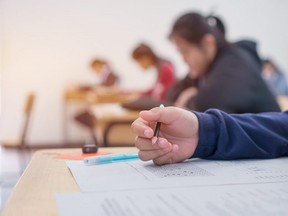 University students taking an exam.