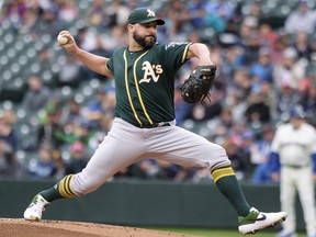 Starter Tanner Roark of the Oakland Athletics delivers a pitch during the first inning of a game against the Seattle Mariners at T-Mobile Park on September 29, 2019 in Seattle, Washington.