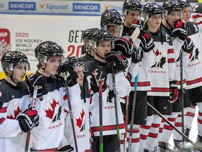 Team Canada players watch the post-game ceremony after losing 6-0 to Russia at the World Junior Championship, Saturday, December 28, 2019 in Ostrava, Czech Republic. (THE CANADIAN PRESS/Ryan Remiorz)