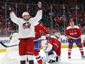 Columbus Blue Jackets center Riley Nash celebrates after scoring a goal on Washington Capitals goaltender Braden Holtby in the third period at Capital One Arena. Mandatory Credit: Geoff Burke-