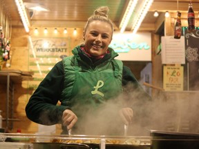 Kathrin Loosen works at her family-run vegetarian food stall at the Aachen Christmas Market. (Ian Shantz/Toronto Sun)