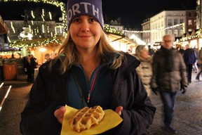 No trip to the Christmas market is ever complete without tasting a waffle, as Sara Shantz can attest to. (Ian Shantz/Toronto Sun)