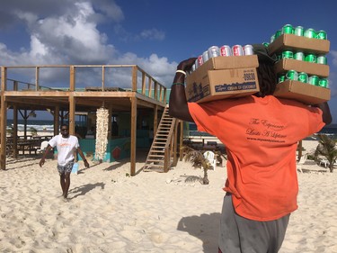 Unloading supplies for the restaurant at  Sandy Island, off the coast of Anguilla