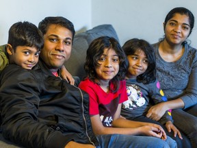 Recent immigrants from India, Varun Muriyanat, his wife Neenu Mary, and their kids, Maria, 8, Saya, 6, and Mathew, 4, at their Scarborough home in Toronto, Ont. on Saturday, Dec. 21, 2019. (Ernest Doroszuk/Toronto Sun/Postmedia Network)