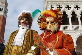 Revellers in ornate, outrageous costumes and colourful masks descend upon Venice during Carnival. (Simon Griffith photo)