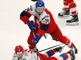 Czech Republic's Jan Jenik, right, challenges Russia's Danil Zhuravlyov, left, during the U20 Ice Hockey Worlds match between Czech Republic and Russia in Ostrava, Czech Republic, Thursday, Dec. 26, 2019.