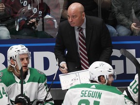 Dallas Stars coach Jim Montgomery draws up a play during a timeout against the Colorado Avalanche on Friday, Nov. 1, 2019, in Denver. (THE CANADIAN PRESS/AP/David Zalubowski)