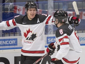 Canada's Ty Dellandrea (left) celebrates with teammate Liam Foudy (right) after scoring the fourth goal against Germany during the third period at the World Junior Hockey Championships, Monday, Dec. 30, 2019 in Ostrava, Czech Republic.