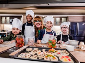 Chef Mary Berg bakes up a batch of cookies with SickKids ambassadors (from left to right)  Norah, 4, Tahcari, 9, Sahara, 9, Mason, 7. (Samsung Canada photo)