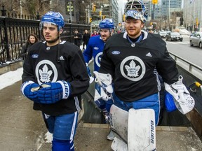 Maple Leafs forward Auston Matthews (left) and goaltender Frederik Andersen exit the Osgoode subway station on their way to an outdoor practice at Nathan Phillips Square in Toronto, on Feb. 7, 2019.