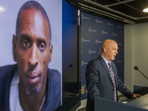 Homicide Det.-Sgt. Rob North updates media on the 71st murder of the year at Toronto Police headquarters on Saturday, Dec. 21, 2019. Karl Hoyes (pictured on screen), 49, is charged with first-degree murder in the killing of a woman, 66, at 1765 Weston Rd. (Ernest Doroszuk/Toronto Sun/Postmedia Network)