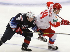 Nick Robertson (left) of the U.S. and Grigoriy Denisenko of Russia in action during the World Junior Hockey Championships in Ostrava, Czech Republic, Monday, Dec. 29, 2019.