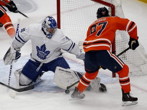 Toronto Maple Leafs goalie Frederik Andersen (left) makes a save on Edmonton Oilers captain Connor McDavid during first period NHL hockey game action in Edmonton on Saturday December 14, 2019. (PHOTO BY LARRY WONG/POSTMEDIA)