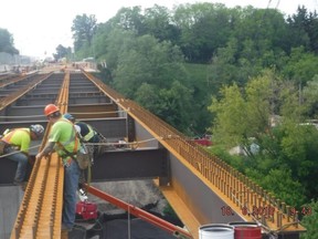 A City of Toronto photograph allegedly showing workers without proper fall arrest gear at the Morningside Ave. bridge widening project, undertaken by Toronto Zenith Contracting Ltd.