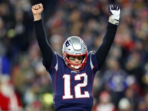 Tom Brady of the New England Patriots celebrates after Rex Burkhead scored a touchdown against the Buffalo Bills at Gillette Stadium on December 21, 2019 in Foxborough.  (Maddie Meyer/Getty Images)