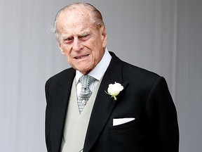 Prince Philip waits for the bridal procession following the wedding of Princess Eugenie of York and Jack Brooksbank in St George's Chapel, Windsor Castle, near London, Britain Oct. 12, 2018.