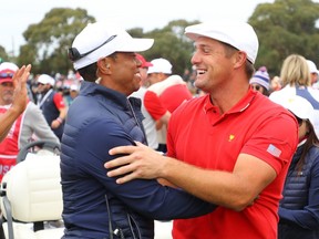 Playing captain Tiger Woods and Bryson DeChambeau of the U.S. team celebrate winning the Presidents Cup during Sunday Singles matches of the 2019 Presidents Cup at Royal Melbourne Golf Course in Melbourne, Australia, on Sunday, Dec. 15, 2019.
