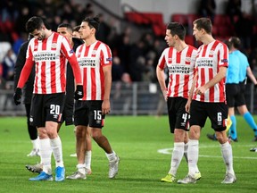 PSV Eindhoven players walk off the pitch after a Europa League match against Rosenborg at Philips Stadium, in Eindhoven, Netherlands, Dec. 12, 2019.