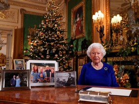 Britain's Queen Elizabeth poses, after recording her annual Christmas Day message in Windsor Castle, in Berkshire, Britain, in this undated picture released on Tuesday, Dec. 24, 2019. (Steve Parsons/Pool via REUTERS)