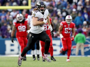Hayden Hurst of the Baltimore Ravens scores a touchdown during the third quarter of an NFL game against the Buffalo Bills at New Era Field on Dec. 8, 2019 in Orchard Park, N.Y.