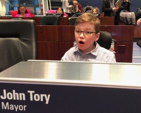 Zach sitting in the mayor’s chair at City Hall in November 2019. (Simon Rayment photo)