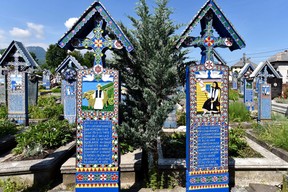 Romania’s colourful Merry Cemetery celebrates its dead with poetry and stylized portraits. (Cameron Hewitt)
