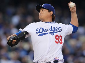 Hyun-Jin Ryu of the Los Angeles Dodgers pitches against the Colorado Rockies at Dodger Stadium on April 30, 2013 in Los Angeles. (Victor Decolongon/Getty Images)