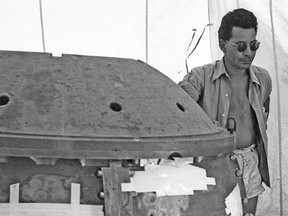 Winnipeg-born Dr. Louis Slotin completes final assembly of 'The Gadget' — the world's first atomic bomb — at the Trinity test site south of Albuquerque, NM in July 1944.