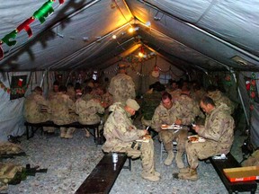 Soldiers of Alpha Company (A Coy), 1st Battalion, The Royal Canadian Regiment Battle Group (1 RCR BG) have Christmas dinner at Forward Operating Base Ma'Sum Ghar.