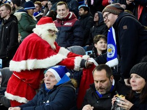 Leicester City fans acknowledge that the Premier League title may be out of reach, but they hope that Santa Claus brings them the FA Cup and the Carabao Cup this season. (REBECCA NADEN/Reuters)