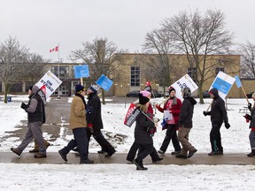 Teachers and support staff represented by the Ontario Secondary School Teachers Federation (OSSTF) picket in front of Pauline Johnson Collegiate in Brantford, Ontario on Wednesday, Dec. 4, 2019 during a one-day, province-wide strike. (Brian Thompson/Brantford Expositor/Postmedia Network)