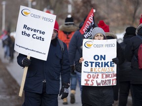 Educators picket outside the Bickford Centre in Toronto on Wednesday Dec. 11, 2019. (THE CANADIAN PRESS/Chris Young)