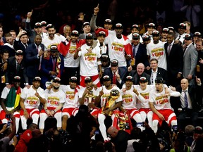 The Raptors pose for a photo after defeating the Golden State Warriors in Game 6 of the NBA Finals to claim the first league title in the franchise’s history. (GETTY IMAGES)