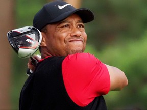 Tiger Woods tees off at the ninth hole during the fourth round of the PGA Zozo Championship golf tournament at the Narashino Country Club in Inzai, Chiba prefecture on Oct. 27, 2019. (TOSHIFUMI KITAMURA/AFP via Getty Images)