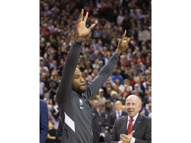 Former Raptors MVP Kawhi Leonard accepts his NBA Championship ring from former team-mate Kyle Lowry before the Raptors / Clippers game in Toronto, Ont. on Wednesday December 11, 2019. Stan Behal/Toronto Sun/Postmedia Network